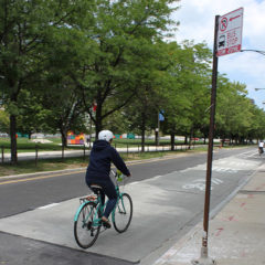 A person riding a bicycle in a bike lane
